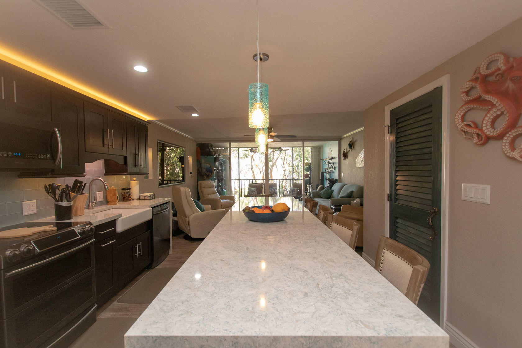 97652 Overseas Highway, Unit M11 Key Largo, FL 33037 - Photo 7 of 48 a large kitchen with sink a stove and a refrigerator