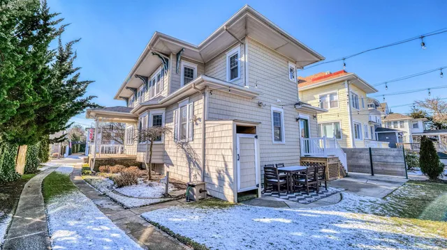 a view of a patio with a table and chairs