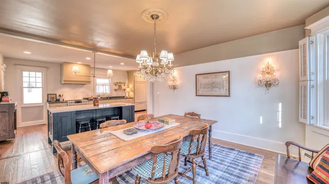 a large kitchen with stainless steel appliances kitchen island granite countertop a large counter top and a stove