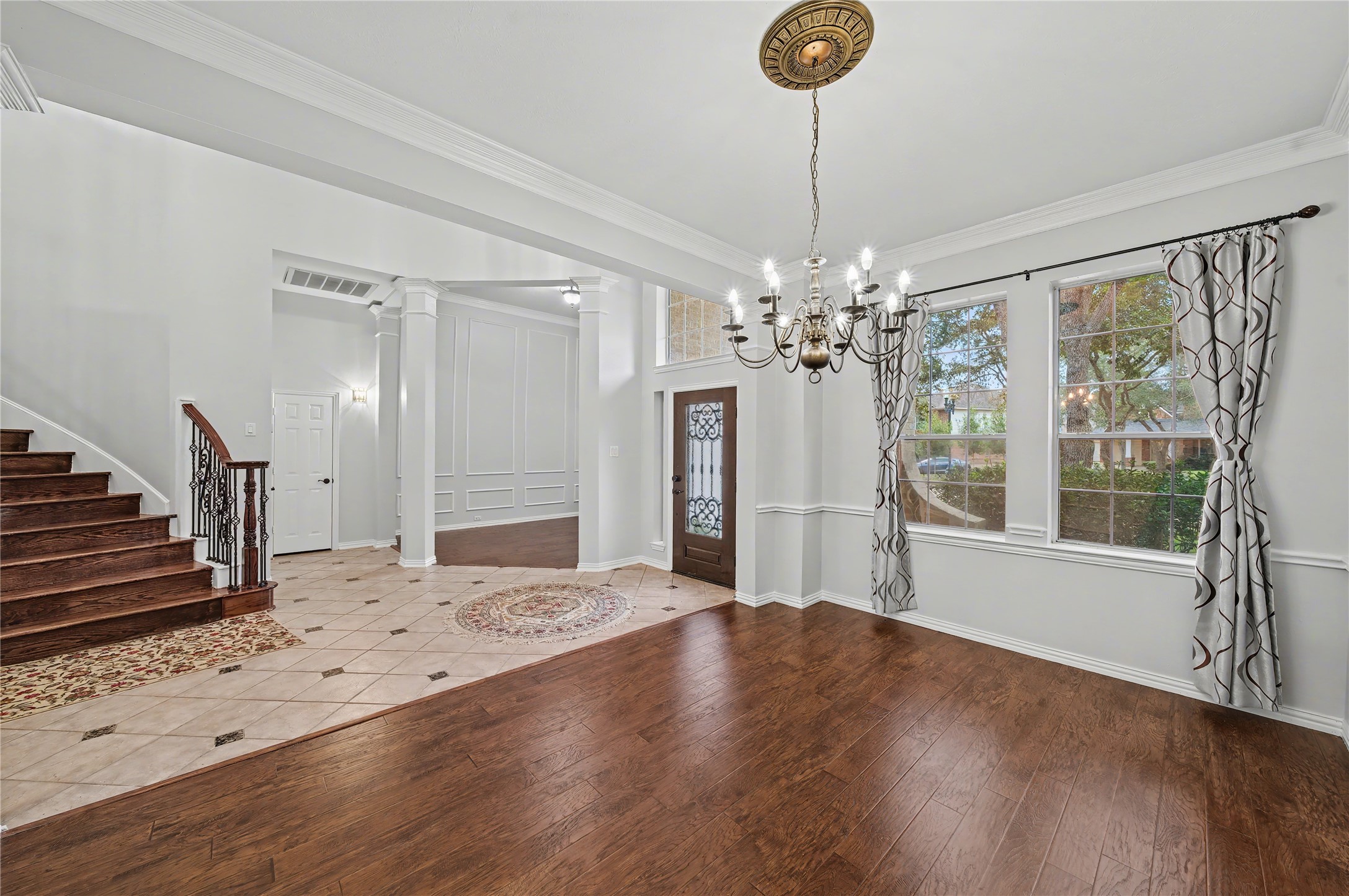 5403 Emerald Pointe Lane Sugar Land, TX 77479 - Photo 9 of 50 a view of an empty room with wooden floor and a window