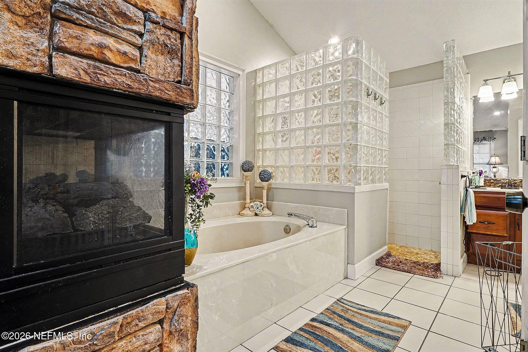 4451 Barber Road Macclenny, FL 32063 - Photo 11 of 18 a bathroom with a bathtub and a shower