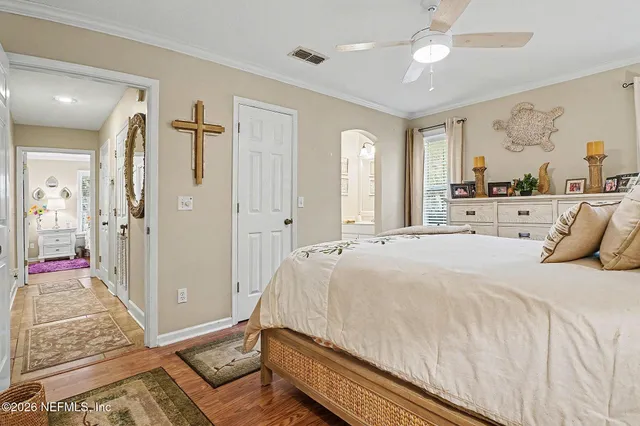 a view of a house with a big yard and large trees