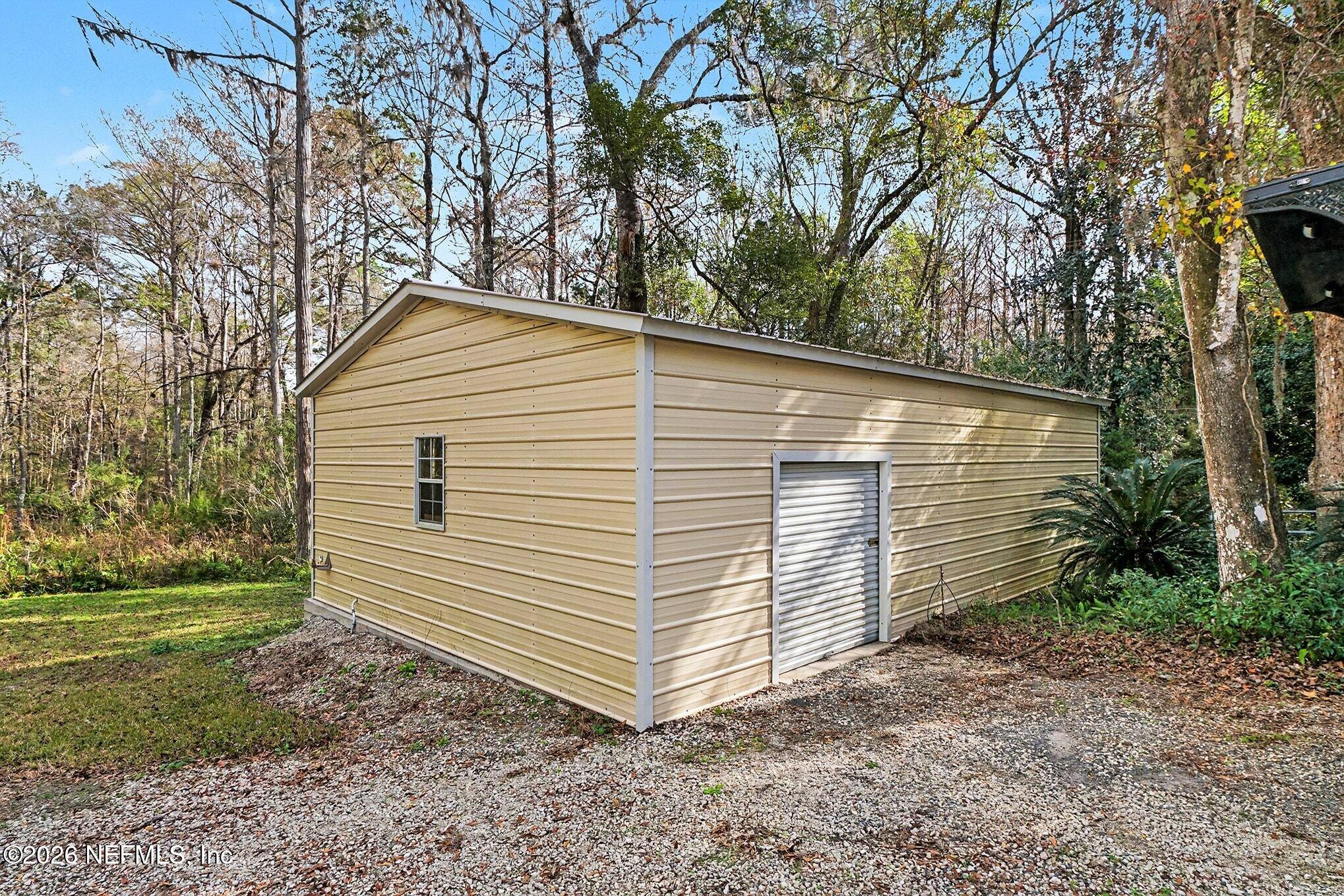 4451 Barber Road Macclenny, FL 32063 - Photo 18 of 18 a view of a house with a yard