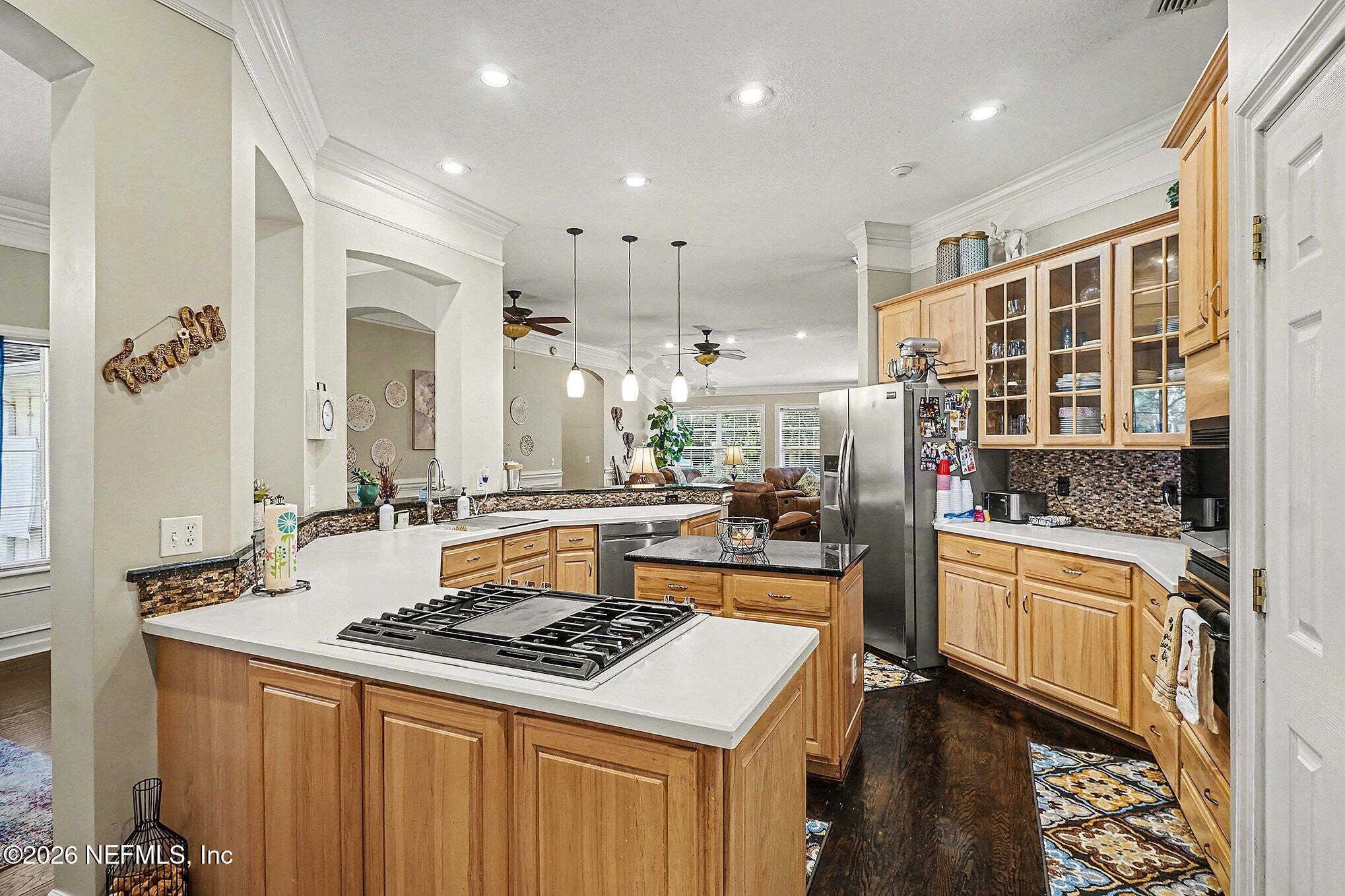 4451 Barber Road Macclenny, FL 32063 - Photo 7 of 18 a kitchen with kitchen island a stove and a sink