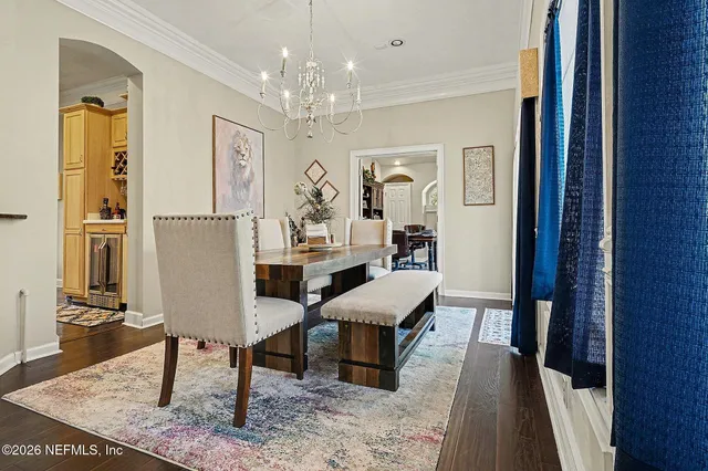 a view of a workspace with furniture and wooden floor