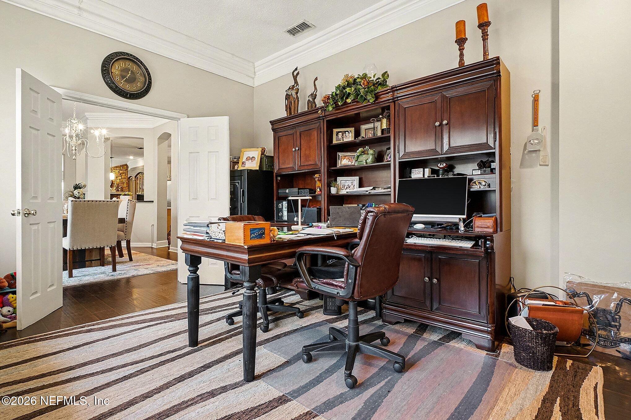 4451 Barber Road Macclenny, FL 32063 - Photo 9 of 18 a view of a workspace with furniture and wooden floor