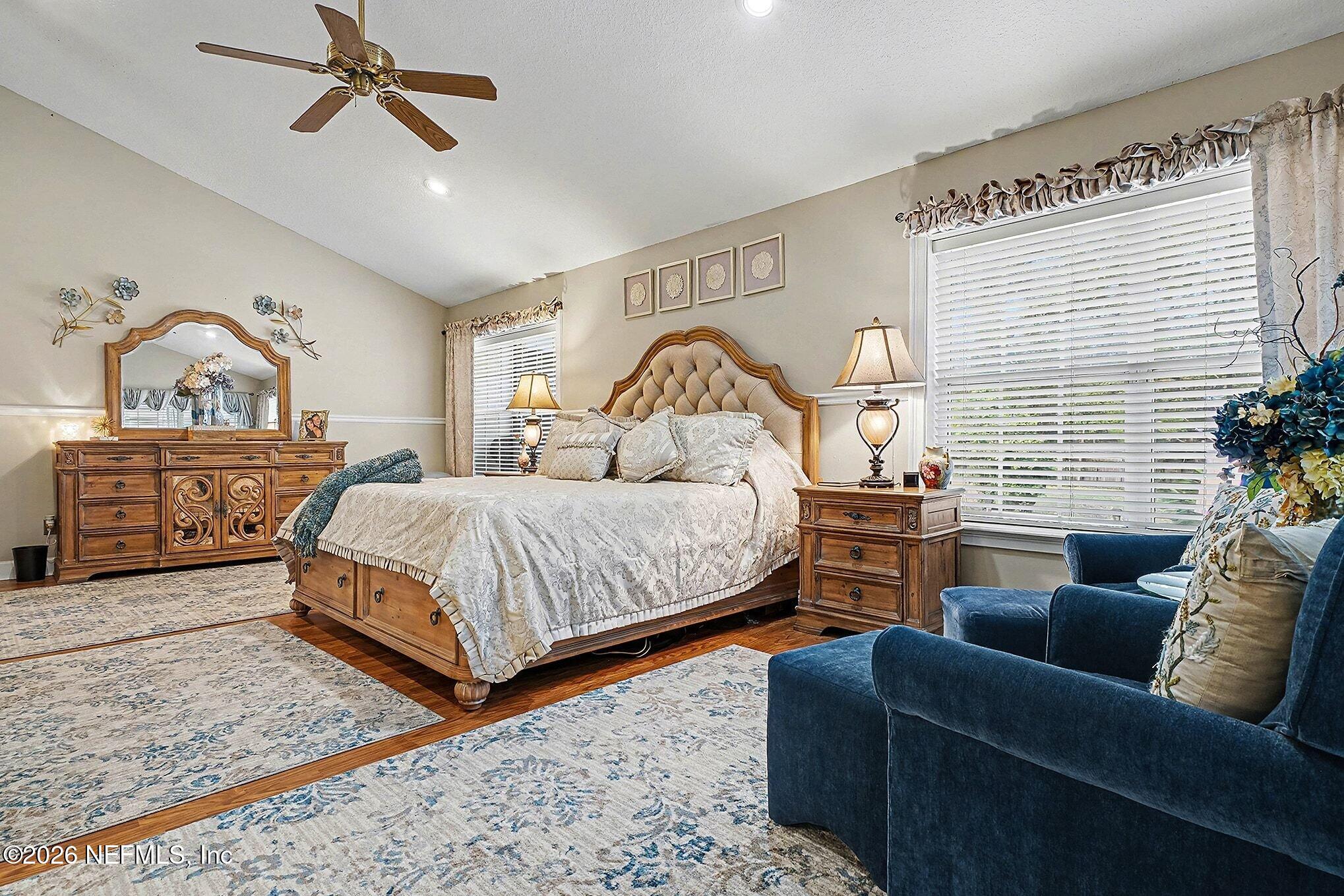 4451 Barber Road Macclenny, FL 32063 - Photo 10 of 18 a bedroom with a bed a couch and dresser