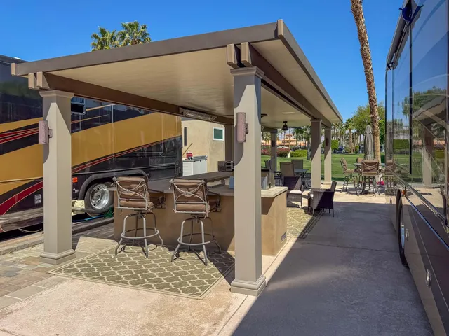 a view of a chairs and table in the patio