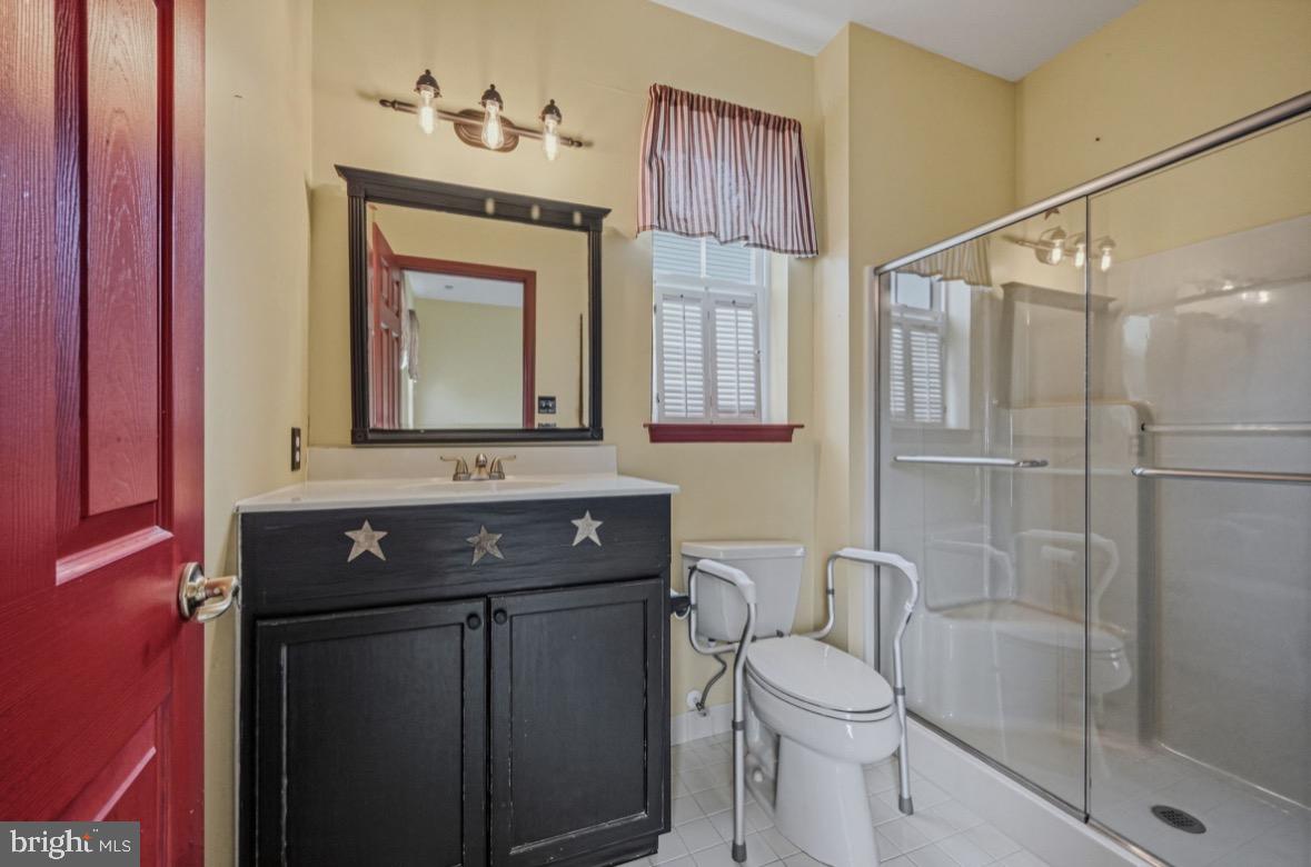 304 Daylilly Way Middletown, DE 19709 - Photo 11 of 20 a bathroom with a toilet sink and shower