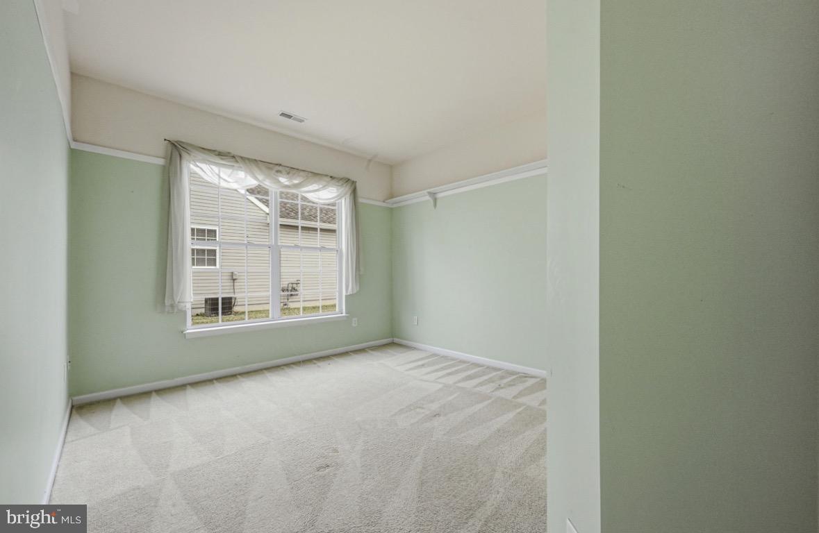 304 Daylilly Way Middletown, DE 19709 - Photo 12 of 20 a view of an empty room with a window