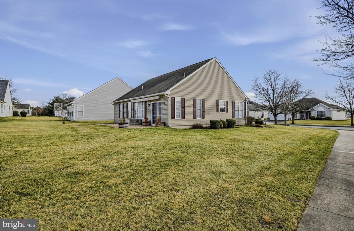 304 Daylilly Way Middletown, DE 19709 - Photo 19 of 20 a front view of house with yard and green space