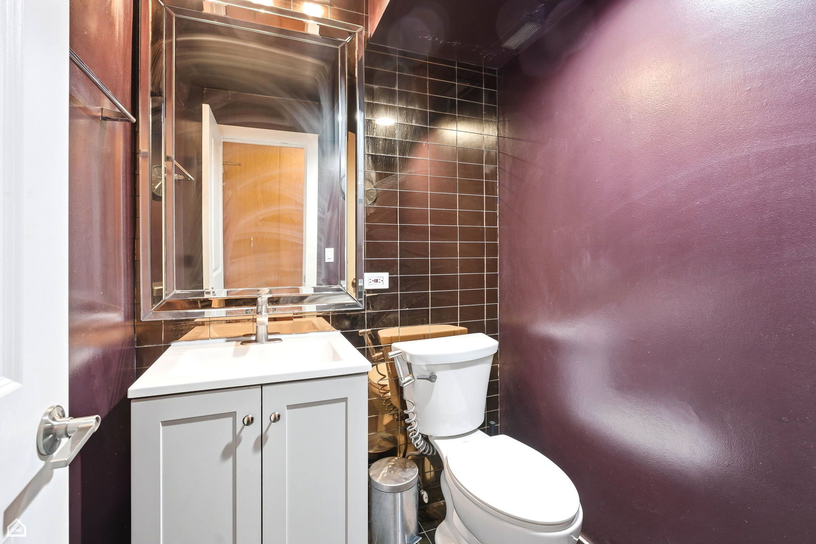 250 Ridge Avenue, Unit 4H Evanston, IL 60202 - Photo 14 of 17 a white toilet sitting next to a bathroom sink