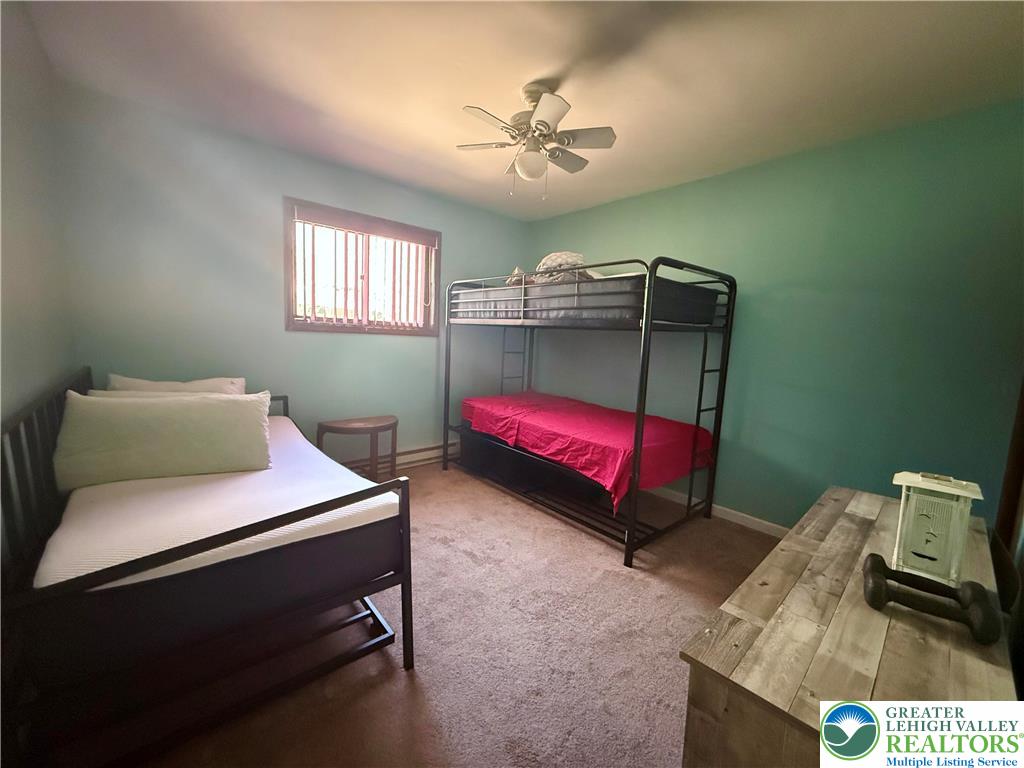 193 Canterbury Road Bushkill, PA 18324 - Photo 11 of 32 a bedroom with a bed and a dresser