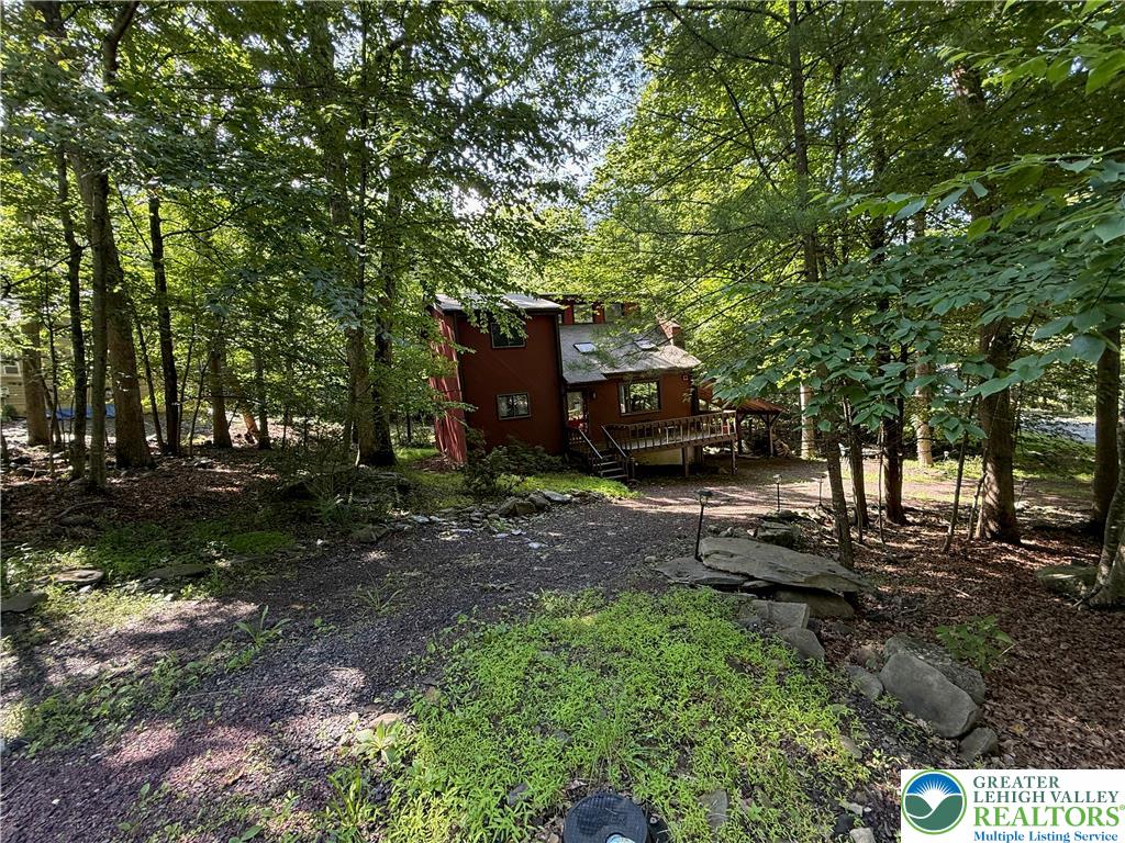 193 Canterbury Road Bushkill, PA 18324 - Photo 3 of 32 a view of a house with backyard and trees