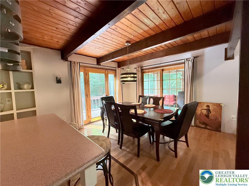 193 Canterbury Road Bushkill, PA 18324 - Photo 6 of 32 a view of a dining room with furniture and wooden floor