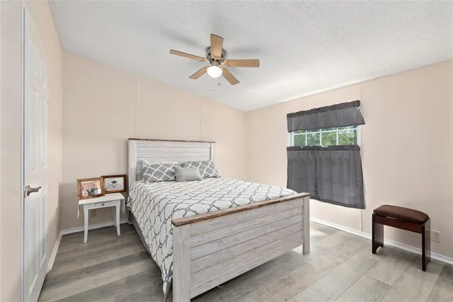 a bedroom with a bed and a chair