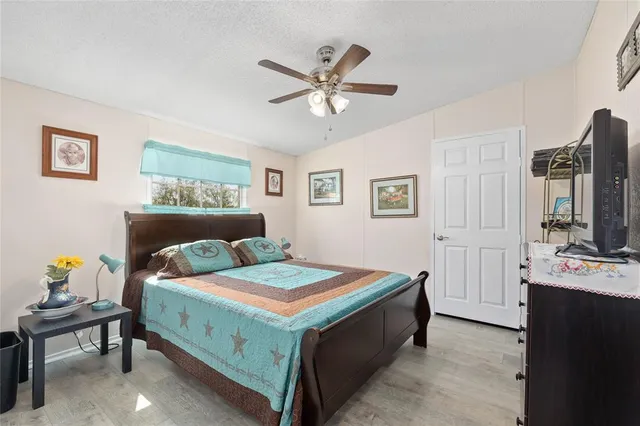 a bedroom with a bed and a table in it