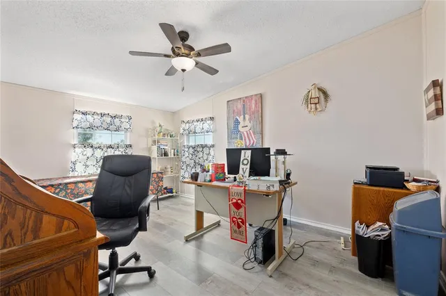 a work room with furniture and windows