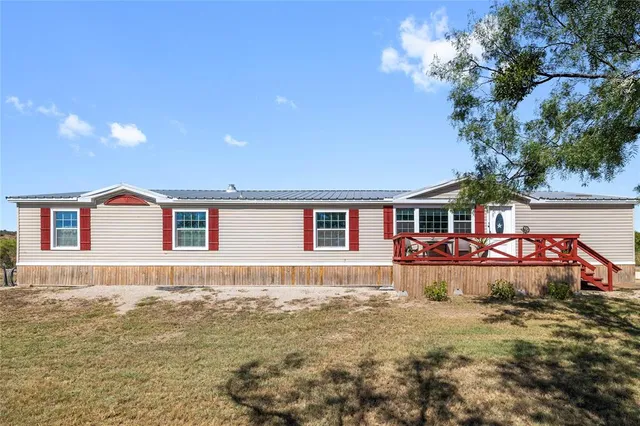 a view of a house with a snow in the yard