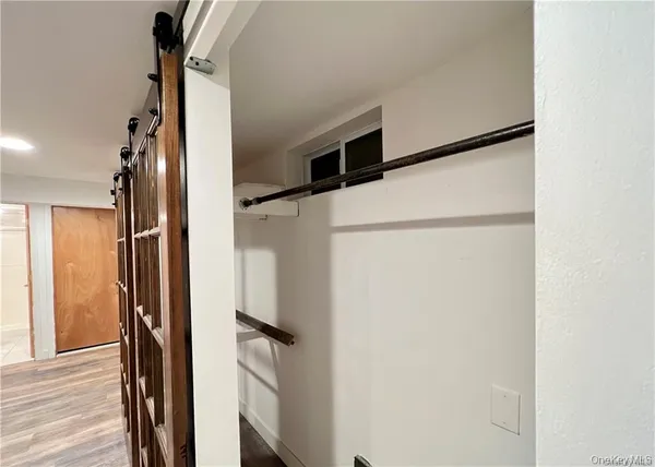 a bathroom with a shower and a mirror