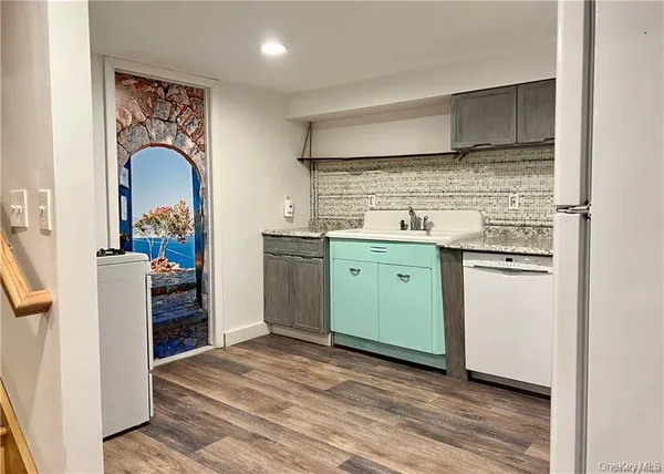 a room with cabinets and wooden floor