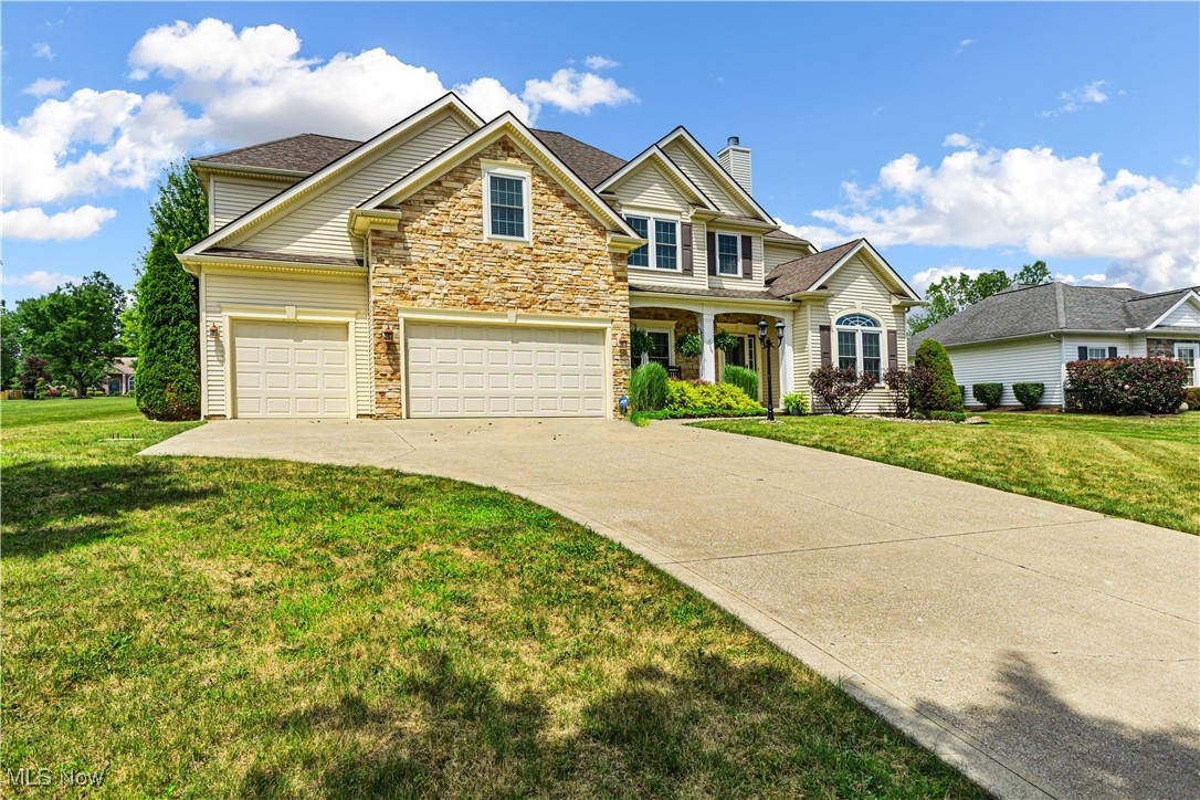 2251 Timber Ridge Trail Streetsboro, OH 44241 - Photo 12 of 48 View of front of home with a garage and a front yard