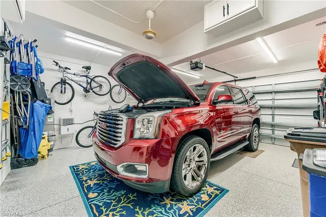 a car and bike parked in a room