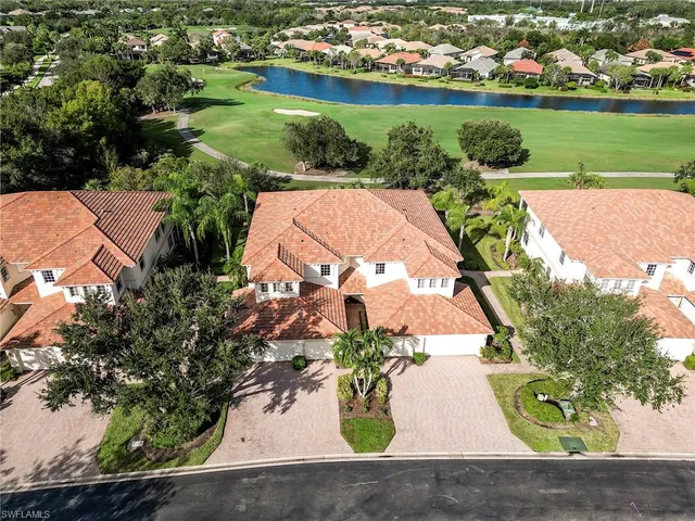 an aerial view of a house with a lake view