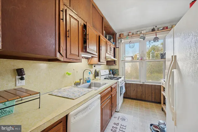 a kitchen that has a sink and a stove