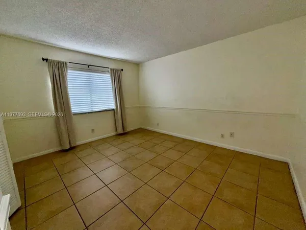 a view of a room with a window