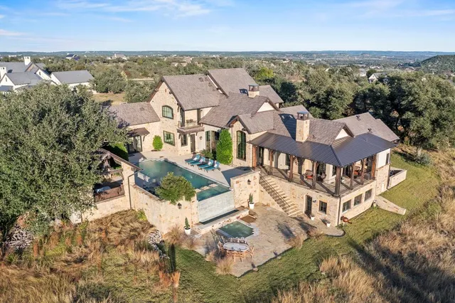 an aerial view of a house with a lake view