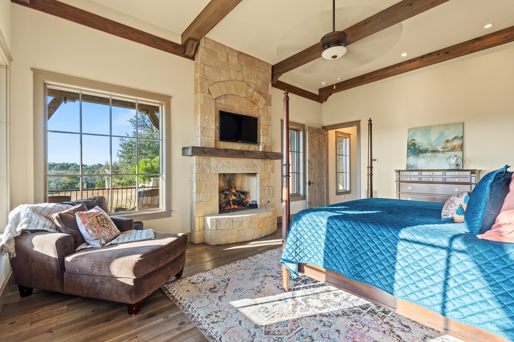 2328 Boot Ranch Circle Fredericksburg, TX 78624 - Photo 6 of 10 a living room with furniture fireplace and flat screen tv