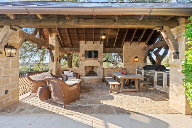 a building outdoor space with patio furniture and potted plants