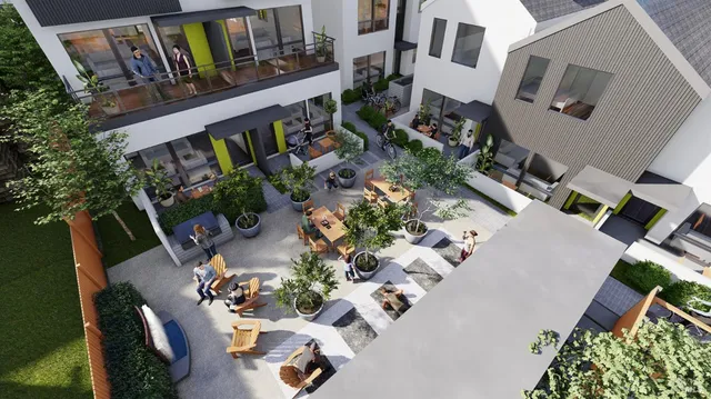 an aerial view of a house with garden space and street view