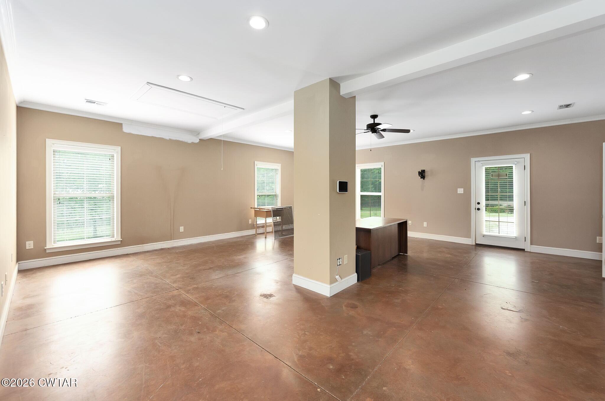 4080 Beech Bluff Road Beech Bluff, TN 38313 - Photo 35 of 41 an empty room with wooden floor and windows