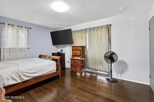 a bedroom with bed and window