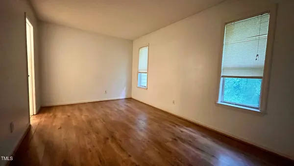 a view of a livingroom with furniture and wooden floor