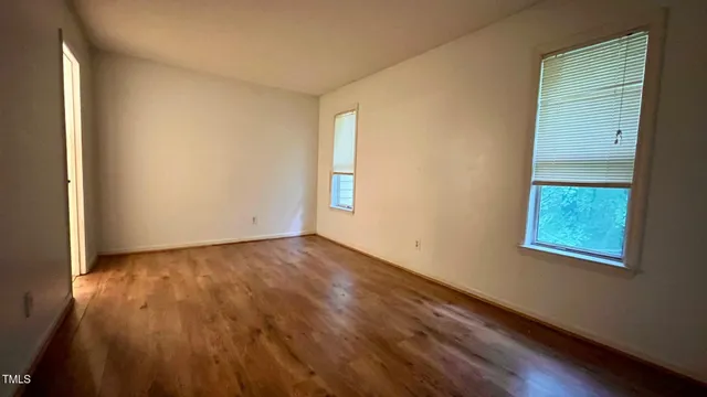 a view of a livingroom with furniture and wooden floor