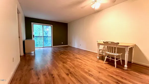 a view of a livingroom with wooden floor