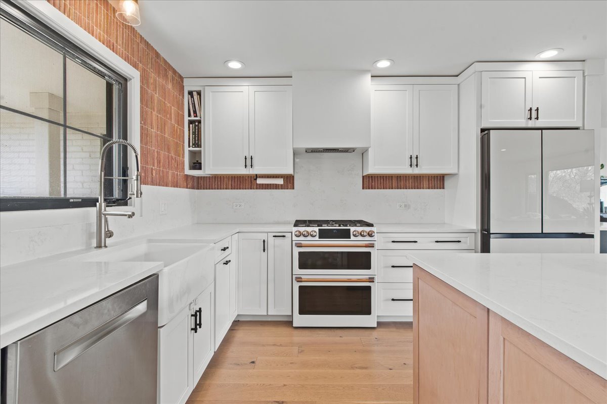 1975 Valley View Road Northfield, IL 60093 - Photo 12 of 45 a kitchen with a sink stove and refrigerator