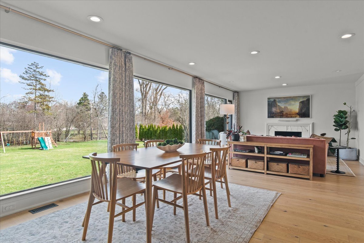 1975 Valley View Road Northfield, IL 60093 - Photo 16 of 45 a view of a dining room with furniture window and wooden floor