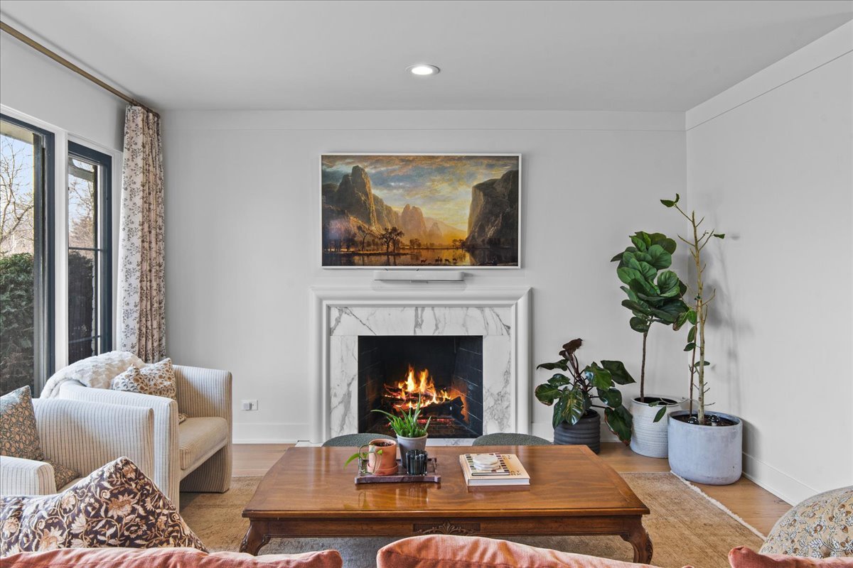 1975 Valley View Road Northfield, IL 60093 - Photo 18 of 45 a living room with furniture fireplace and potted plant