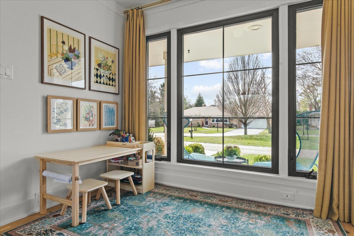 1975 Valley View Road Northfield, IL 60093 - Photo 20 of 45 a dining room with a large window and table
