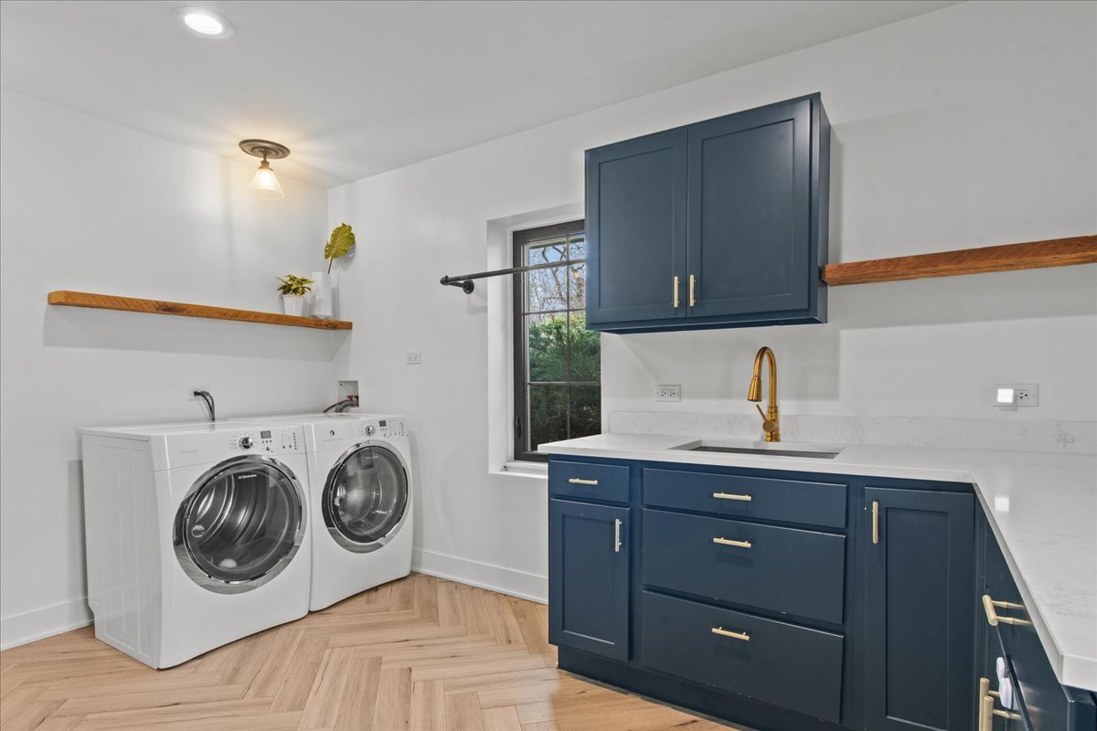 1975 Valley View Road Northfield, IL 60093 - Photo 23 of 45 a utility room with sink dryer and washer