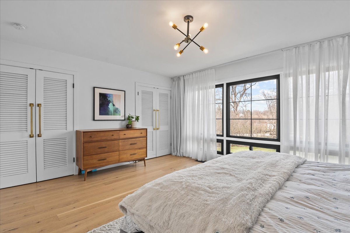 1975 Valley View Road Northfield, IL 60093 - Photo 26 of 45 a bedroom with a bed and a window