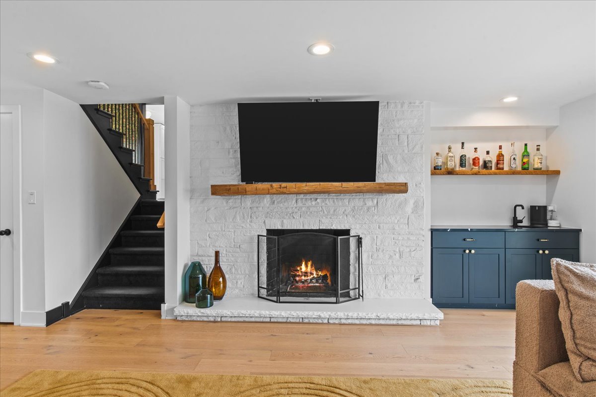 1975 Valley View Road Northfield, IL 60093 - Photo 31 of 45 a living room with furniture and a fireplace
