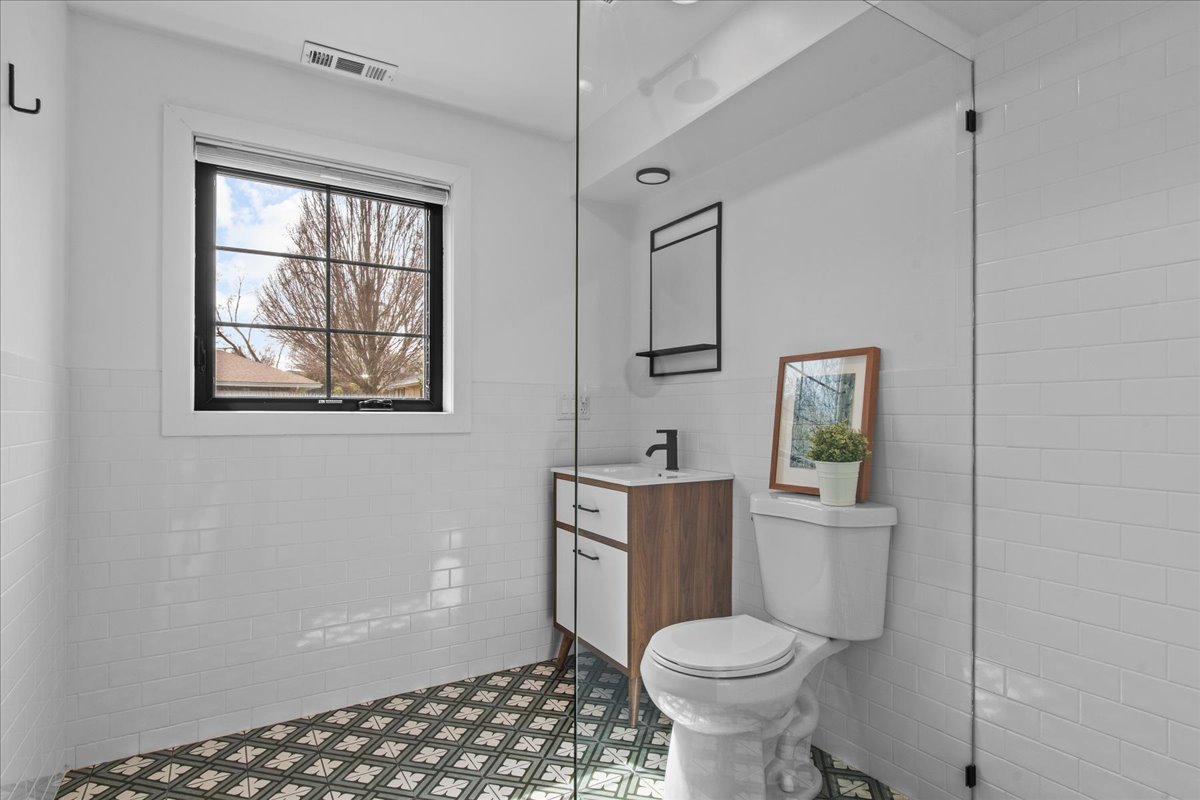 1975 Valley View Road Northfield, IL 60093 - Photo 36 of 45 a bathroom with a toilet sink and window
