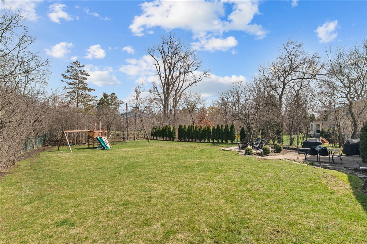 1975 Valley View Road Northfield, IL 60093 - Photo 38 of 45 a backyard of a house with table and chairs
