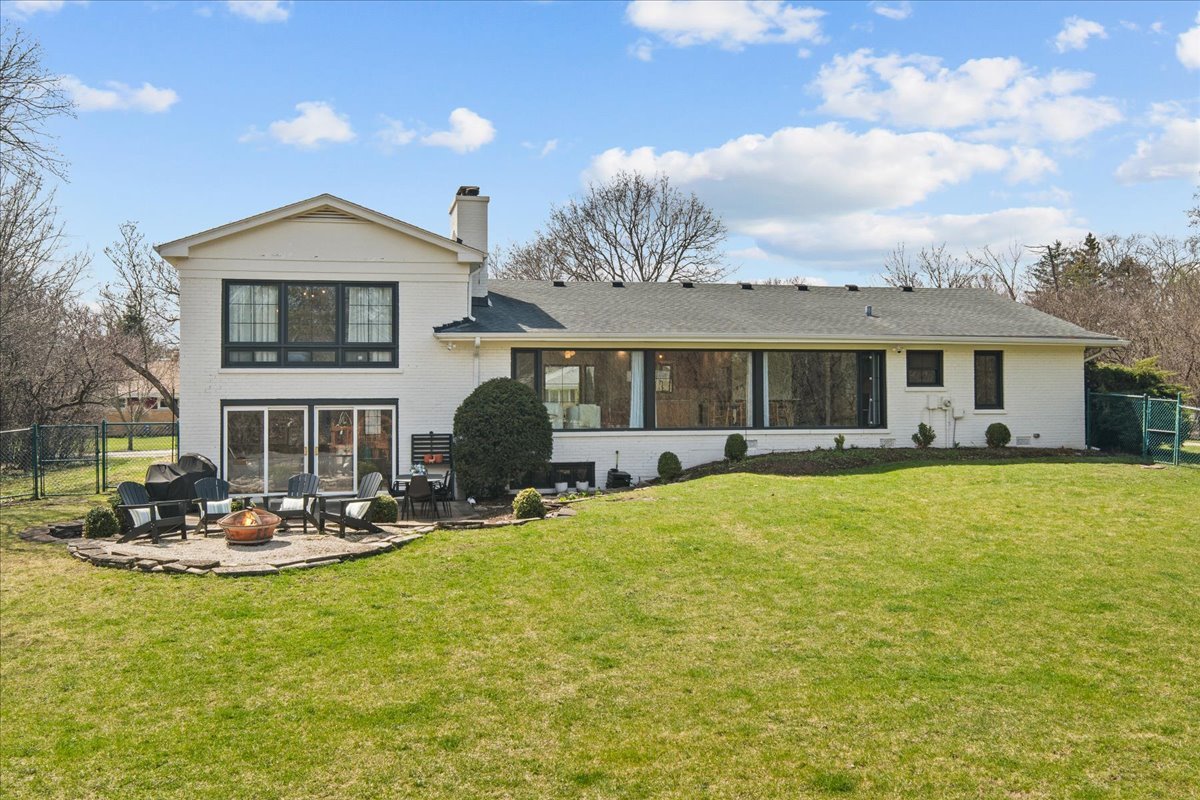 1975 Valley View Road Northfield, IL 60093 - Photo 41 of 45 a front view of house with yard outdoor seating and barbeque oven
