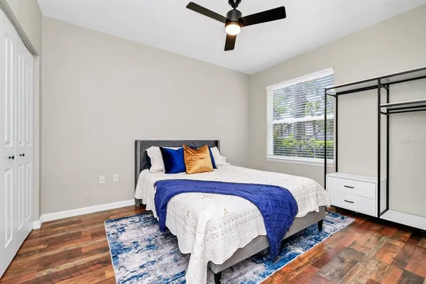 a bed room with a bed and a window